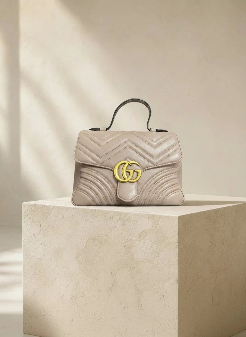 Gucci — GG Marmont Small Top Handle Bag Porcelain / Dusty Nude · Matelassé Chevron Leather · Antique Gold Hardware