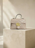 Gucci — GG Marmont Small Top Handle Bag Porcelain / Dusty Nude · Matelassé Chevron Leather · Antique Gold Hardware