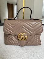Gucci — GG Marmont Small Top Handle Bag Porcelain / Dusty Nude · Matelassé Chevron Leather · Antique Gold Hardware