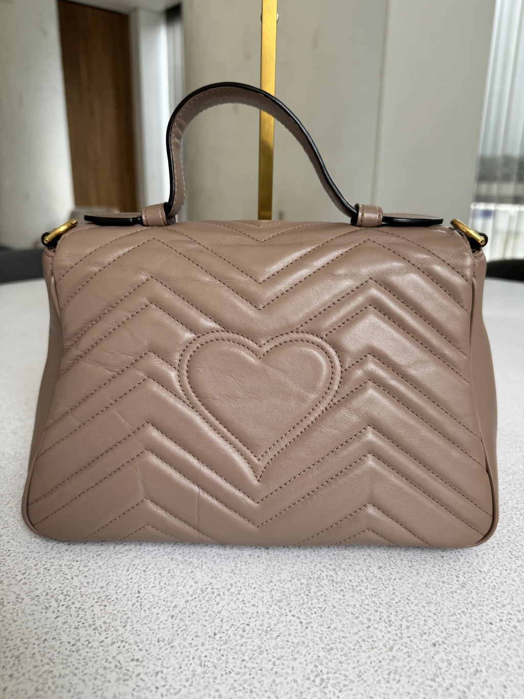Gucci — GG Marmont Small Top Handle Bag Porcelain / Dusty Nude · Matelassé Chevron Leather · Antique Gold Hardware