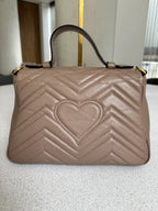 Gucci — GG Marmont Small Top Handle Bag Porcelain / Dusty Nude · Matelassé Chevron Leather · Antique Gold Hardware