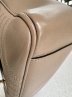 Gucci — GG Marmont Small Top Handle Bag Porcelain / Dusty Nude · Matelassé Chevron Leather · Antique Gold Hardware