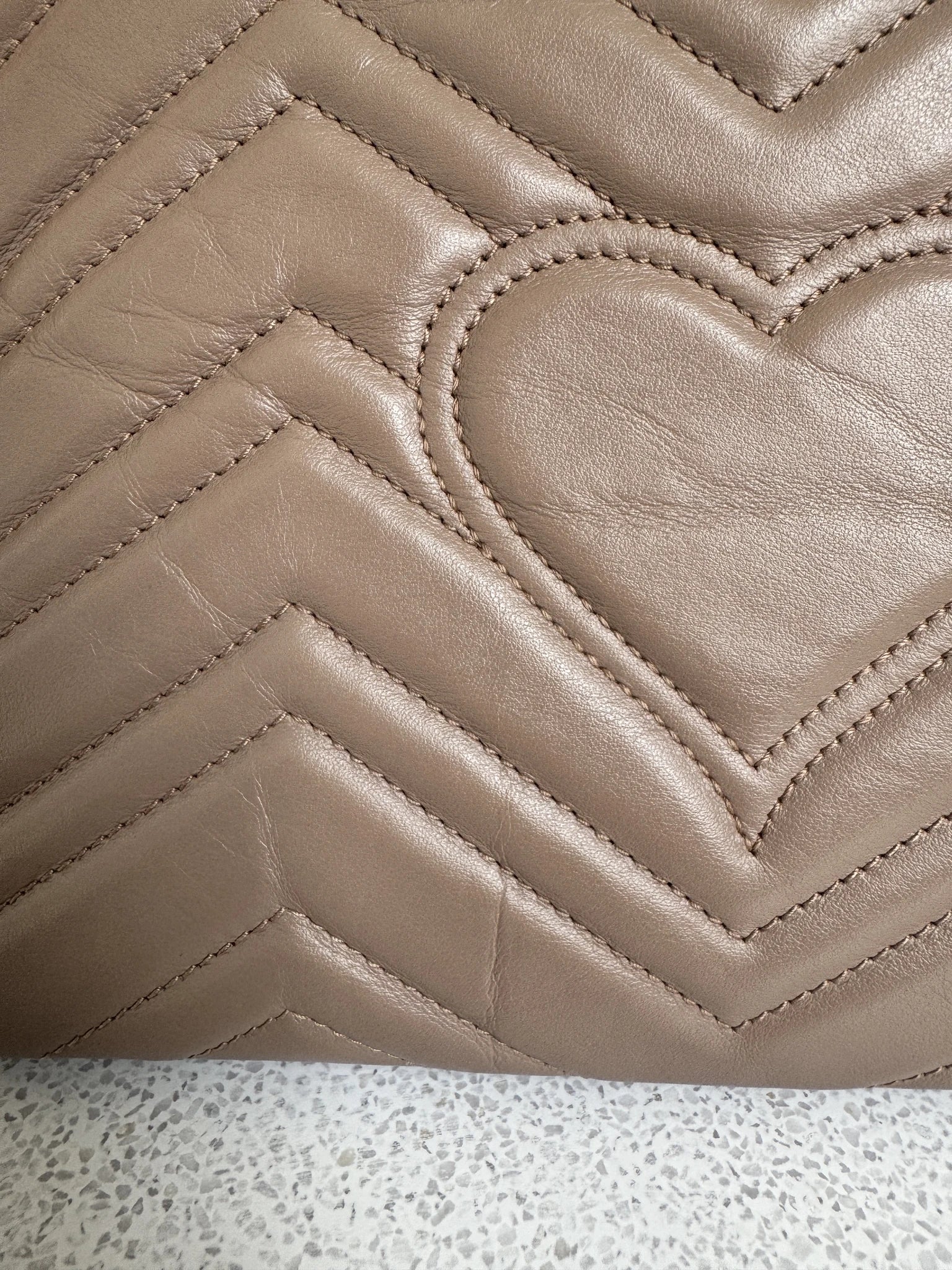 Gucci — GG Marmont Small Top Handle Bag Porcelain / Dusty Nude · Matelassé Chevron Leather · Antique Gold Hardware