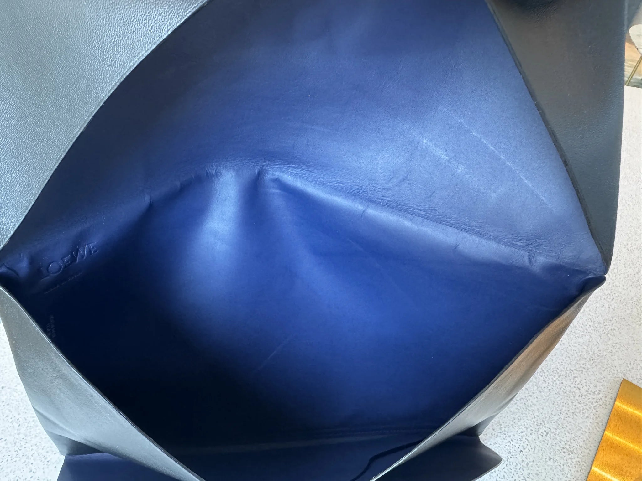 Loewe — Origami Clutch Black · Lambskin · Royal Blue Leather Interior · Made in Spain