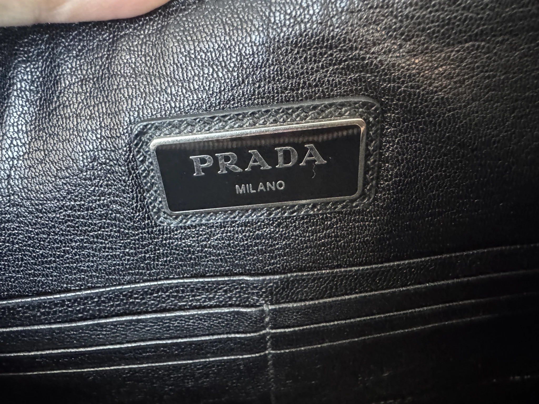 Prada — Large Saffiano Pouch Rubino · Saffiano Leather · Silver Hardware · Made in Italy
