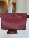 Prada — Large Saffiano Pouch Rubino · Saffiano Leather · Silver Hardware · Made in Italy