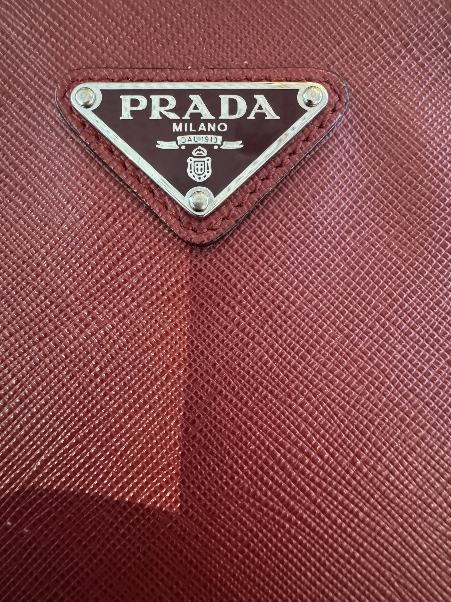 Prada — Large Saffiano Pouch Rubino · Saffiano Leather · Silver Hardware · Made in Italy